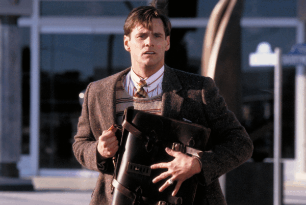 Truman franchissant la porte dans The Truman Show, métaphore d'un dirigeant sortant de sa bulle professionnelle pour retrouver son identité authentique en coaching
